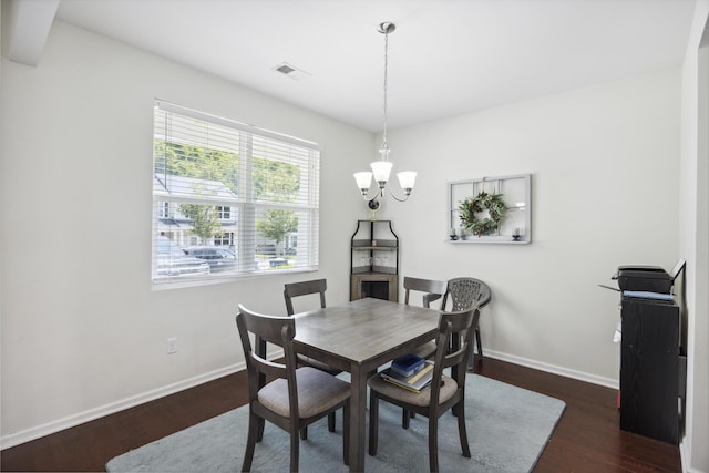 9088 Parlor Dr, Ladson, SC 29456 - dining space featuring a chandelier, baseboards, and dark wood-type flooring