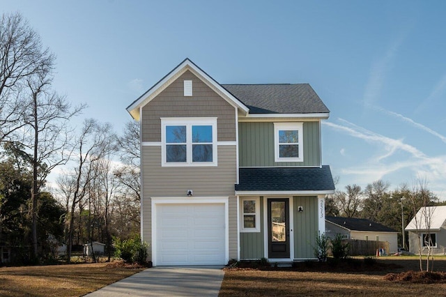 traditional home featuring driveway, a garage, board and batten siding, and roof with shingles