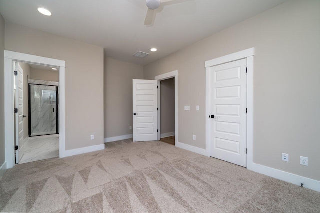 unfurnished bedroom featuring visible vents, baseboards, and carpet floors