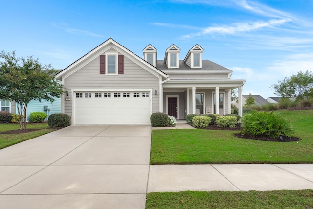 view of front facade featuring a front lawn, covered porch, and concrete driveway