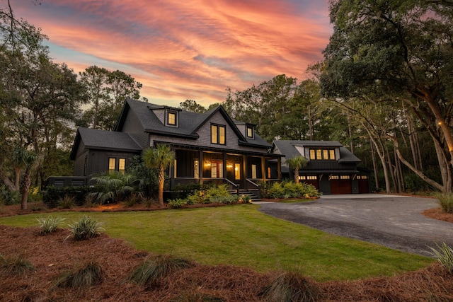 view of front of house featuring a garage and a yard