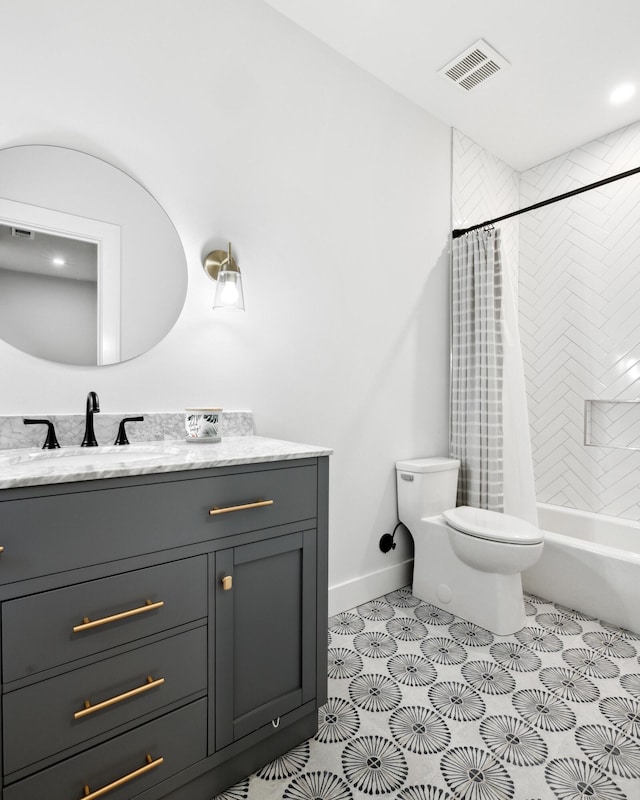 full bathroom featuring tile patterned flooring, vanity, shower / bath combo with shower curtain, and toilet