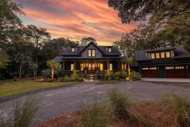 view of front of home with a garage and covered porch