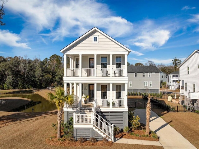 view of front facade featuring a balcony and covered porch