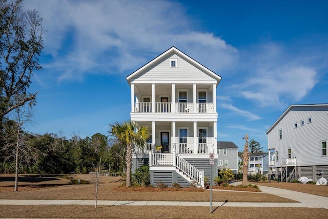 beach home with a porch and a balcony