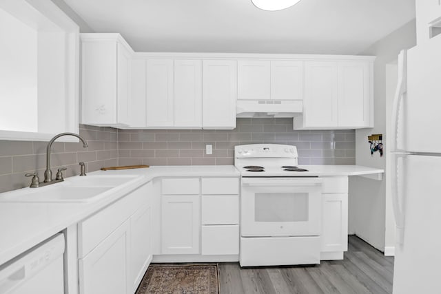 1514 Patterson Ave, Charleston, SC 29412 - kitchen with white appliances, a sink, under cabinet range hood, light countertops, and white cabinetry