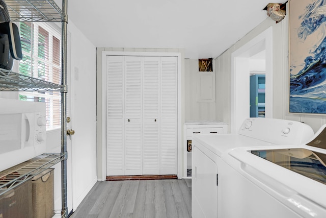 1514 Patterson Ave, Charleston, SC 29412 - laundry area with washer and clothes dryer, light wood-style flooring, and baseboards