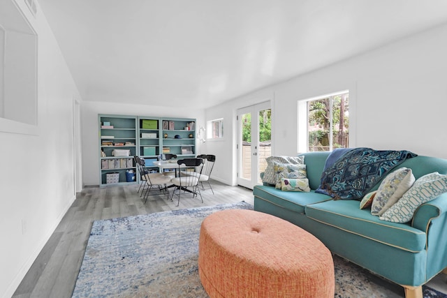 1514 Patterson Ave, Charleston, SC 29412 - living area with french doors, wood finished floors, and baseboards