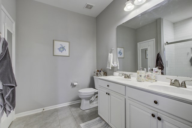 bathroom featuring vanity, toilet, and walk in shower