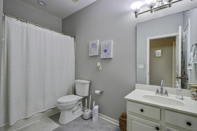 full bathroom with tile patterned flooring, shower / bath combination with curtain, vanity, and toilet