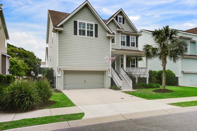 2241 Dewees Creek Dr, Mount Pleasant, SC 29466 - coastal inspired home with covered porch, driveway, a garage, and a front yard