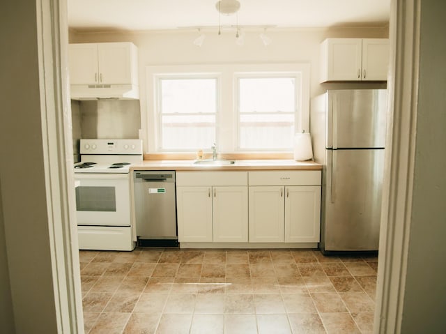 317 Bay St, Walterboro, SC 29488 - kitchen with dishwasher, freestanding refrigerator, white electric range, under cabinet range hood, and white cabinetry