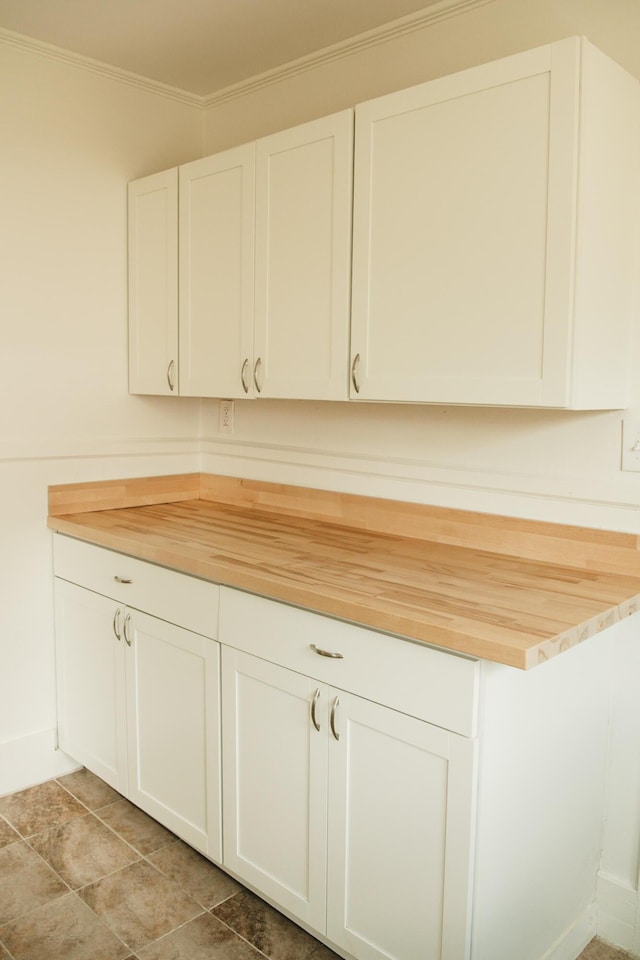 317 Bay St, Walterboro, SC 29488 - kitchen featuring wood counters, white cabinets, and crown molding