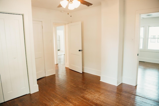 317 Bay St, Walterboro, SC 29488 - unfurnished bedroom with dark wood-style floors, a ceiling fan, and a closet