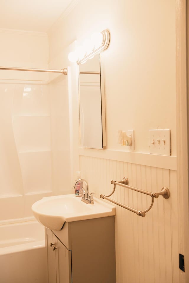 317 Bay St, Walterboro, SC 29488 - full bath featuring vanity,  shower combination, crown molding, and a decorative wall