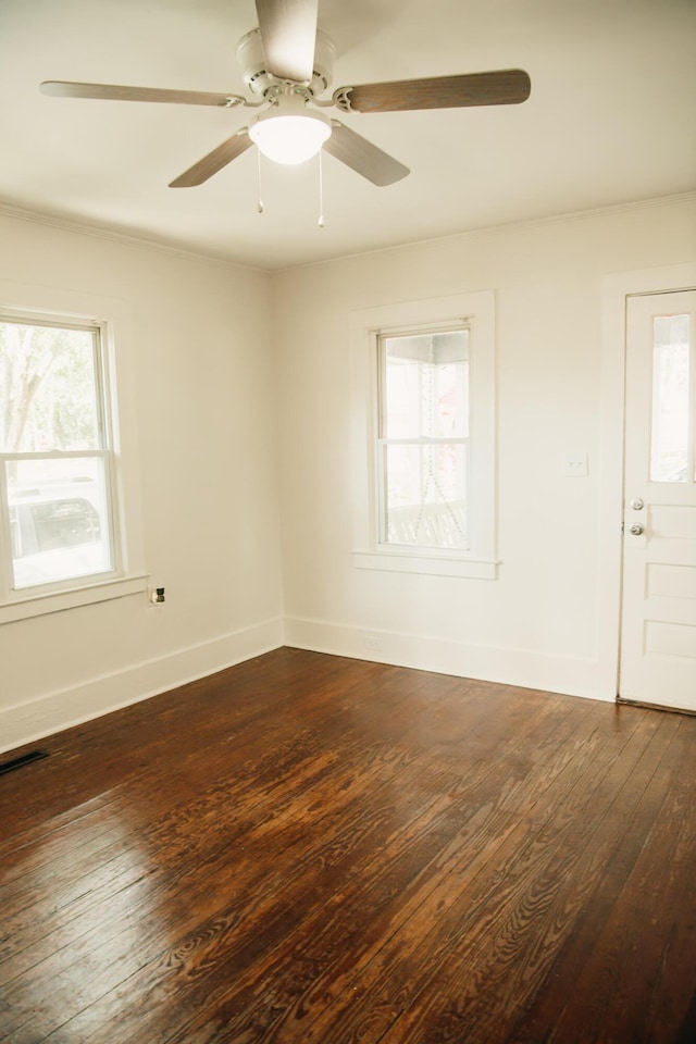 317 Bay St, Walterboro, SC 29488 - empty room featuring healthy amount of natural light, dark wood-style floors, and a ceiling fan