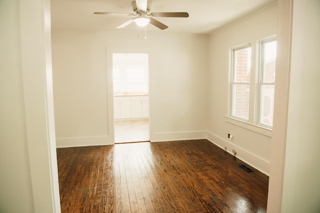 317 Bay St, Walterboro, SC 29488 - unfurnished room featuring dark wood-type flooring and a ceiling fan