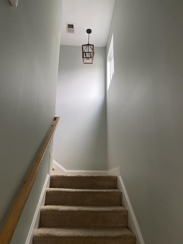 stairs featuring baseboards