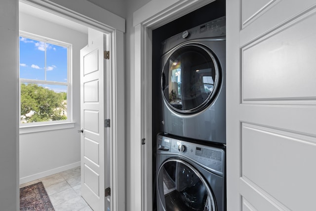 4419 Louisa Ln, North Charleston, SC 29405 - washroom featuring stacked washing machine and dryer and light tile patterned flooring