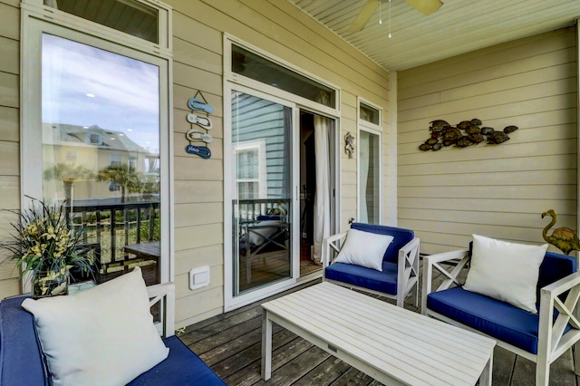 balcony featuring ceiling fan and a porch