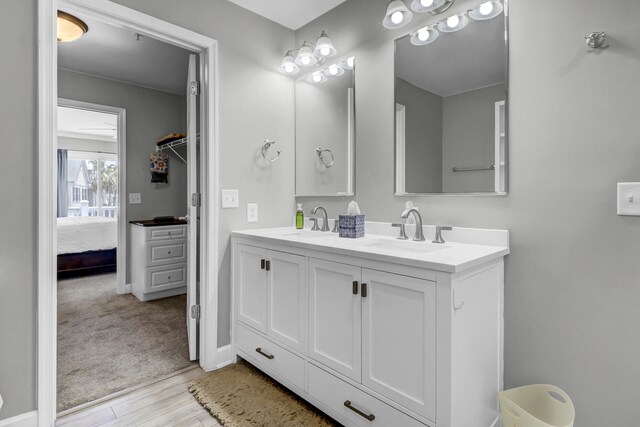 bathroom featuring vanity and hardwood / wood-style flooring