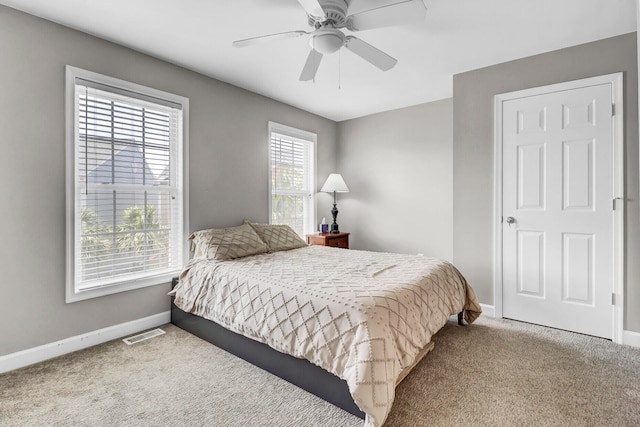 carpeted bedroom featuring ceiling fan