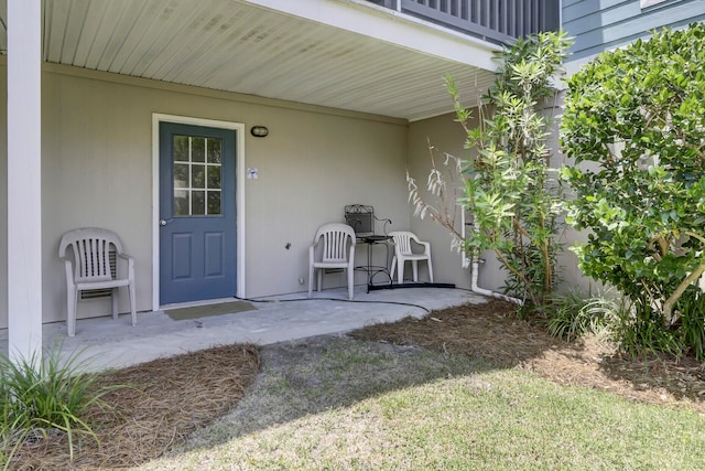 entrance to property with a patio area and a balcony