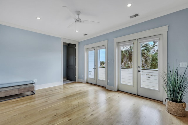 interior space with ceiling fan, french doors, light hardwood / wood-style floors, and ornamental molding