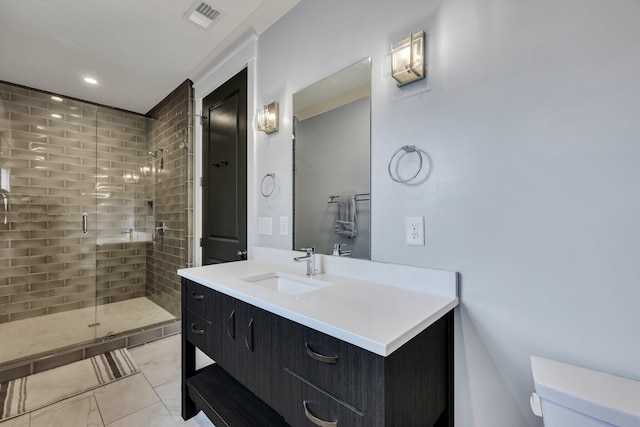 bathroom with walk in shower, tile patterned flooring, vanity, and toilet