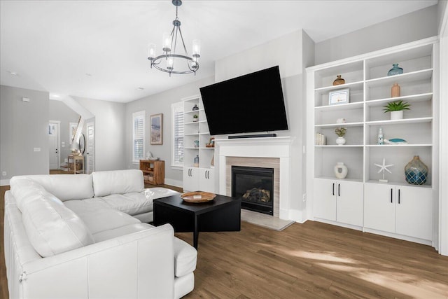 living room with a notable chandelier and hardwood / wood-style floors