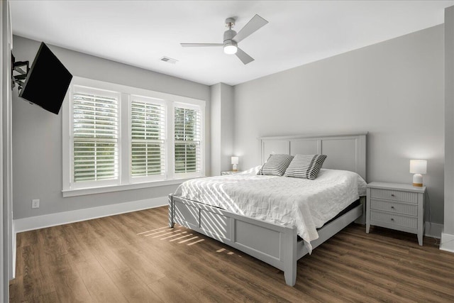 bedroom featuring ceiling fan and dark hardwood / wood-style flooring