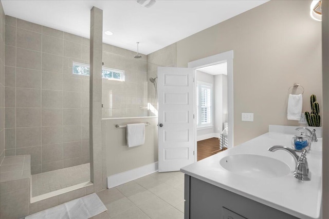 bathroom with vanity, tile patterned floors, and tiled shower