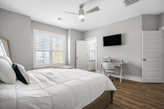 bedroom featuring ceiling fan and dark hardwood / wood-style floors