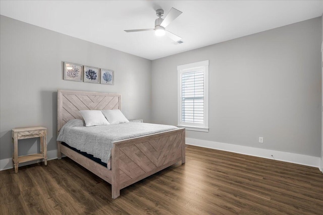 bedroom with dark hardwood / wood-style floors and ceiling fan