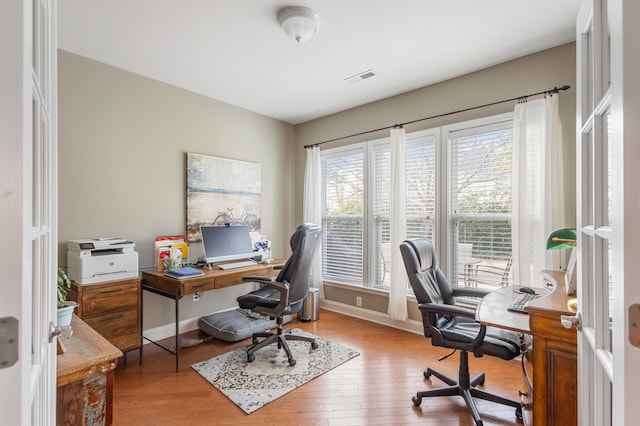 office area with light hardwood / wood-style flooring