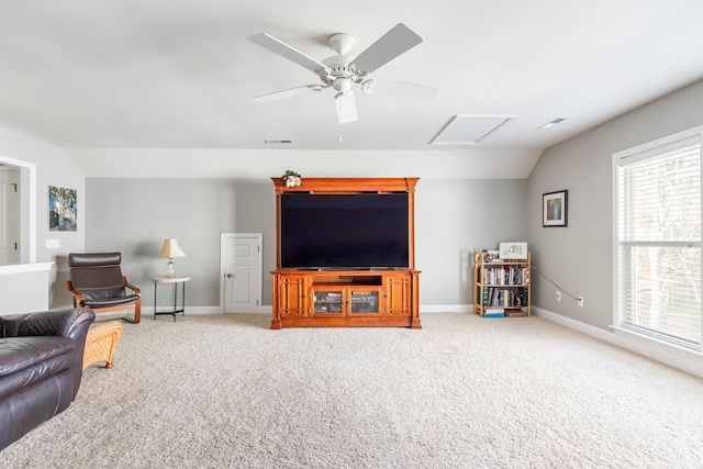 living room with ceiling fan, lofted ceiling, and carpet