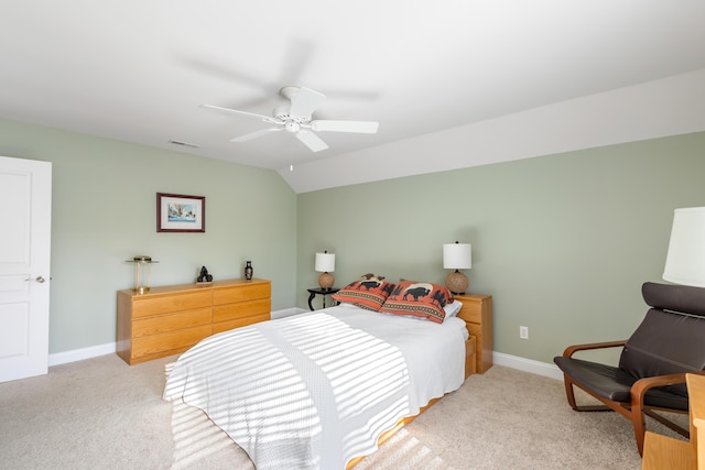 bedroom with vaulted ceiling, light carpet, and ceiling fan