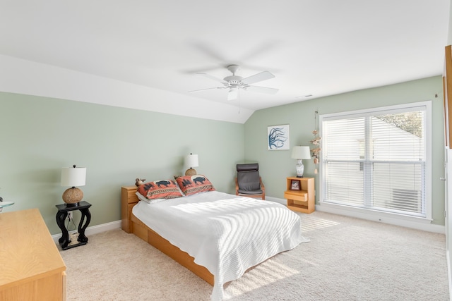 carpeted bedroom featuring vaulted ceiling and ceiling fan