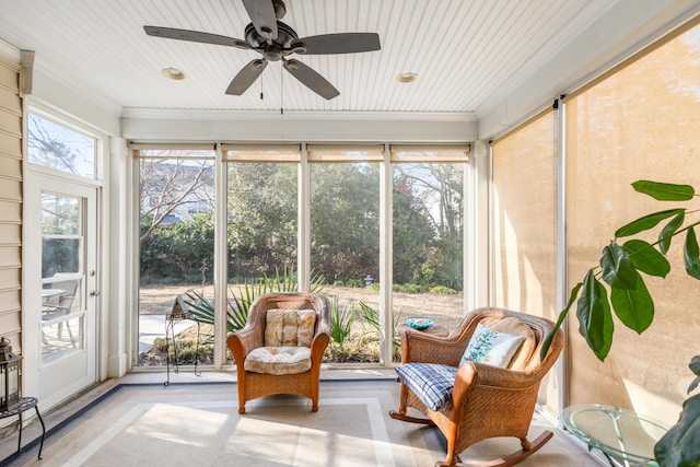 sunroom featuring plenty of natural light and ceiling fan