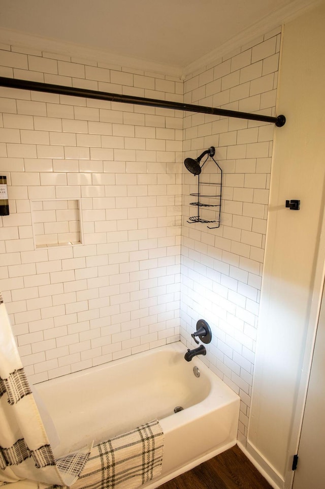 1137 Dickson Ave, Hanahan, SC 29410 - bathroom featuring  shower combination, crown molding, and wood finished floors
