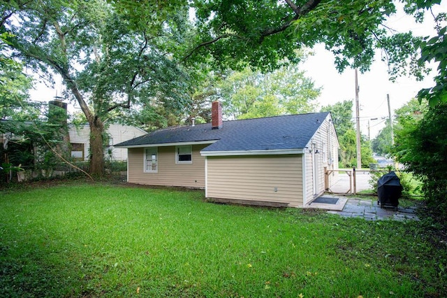 1137 Dickson Ave, Hanahan, SC 29410 - rear view of house featuring a chimney and a shingled roof