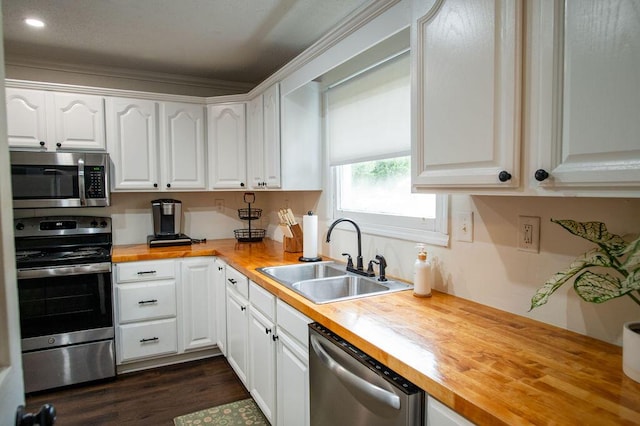 1137 Dickson Ave, Hanahan, SC 29410 - kitchen featuring butcher block counters, stainless steel appliances, white cabinets, recessed lighting, and ornamental molding