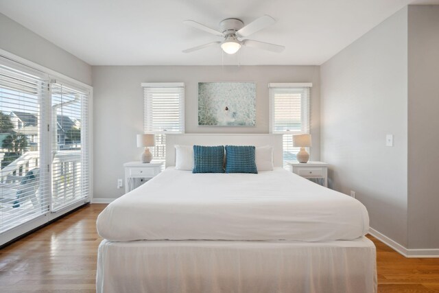 bedroom featuring access to exterior, ceiling fan, and light wood-type flooring