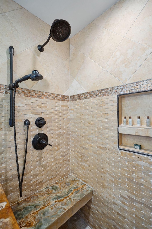 bathroom with tiled shower