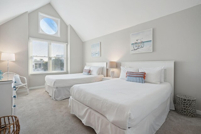 carpeted bedroom featuring lofted ceiling