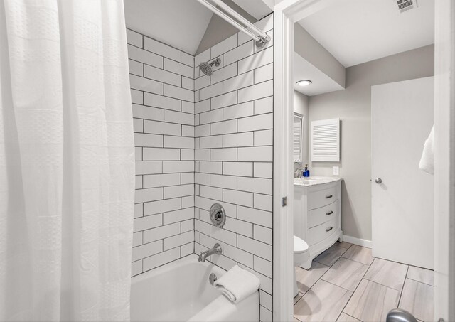 full bathroom featuring vanity, toilet, and shower / bath combo with shower curtain