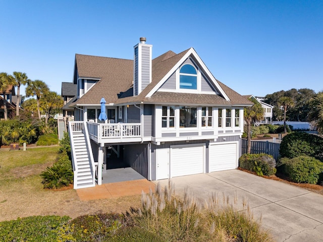 rear view of house with a garage