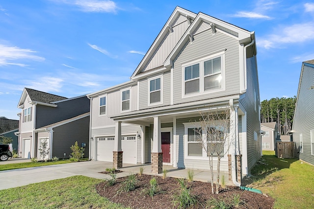 craftsman-style home featuring a garage and a front lawn