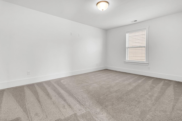 unfurnished room featuring carpet floors