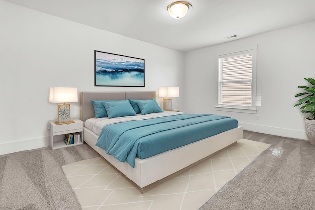 bedroom featuring light carpet